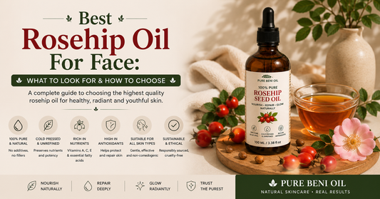 Amber bottle of rosehip seed oil with rosehip berries and rose petals on marble — rosehip seed oil for face benefits