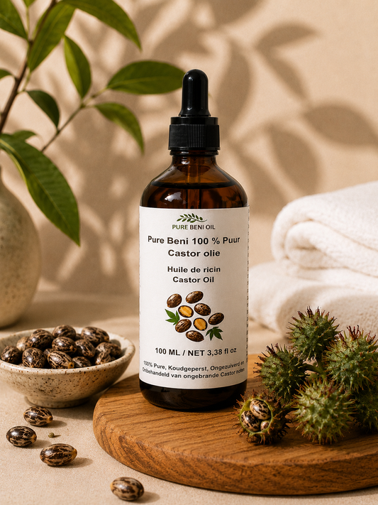 PURE BENI Organic Castor Oil bottle in a natural spa-inspired setting with castor seeds, botanical leaves, and soft warm lighting for hair growth, scalp care, eyelashes, and deep skin hydration.